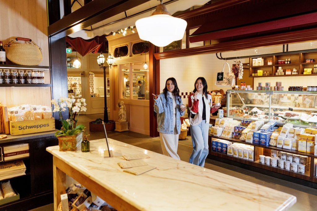 Friends enjoy ice cream strolling through the Laneway, Hay St Market, at Paddy's Market.