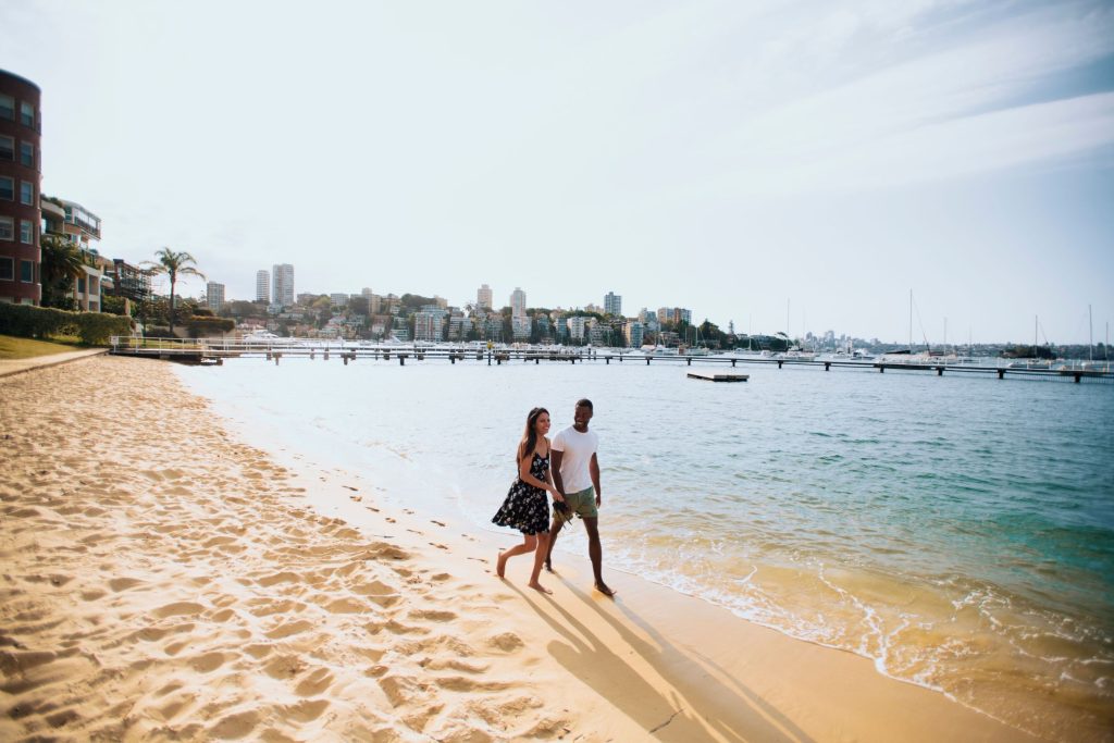 Couple enjoying a walk by Murray Rose Pool, Double Bay.